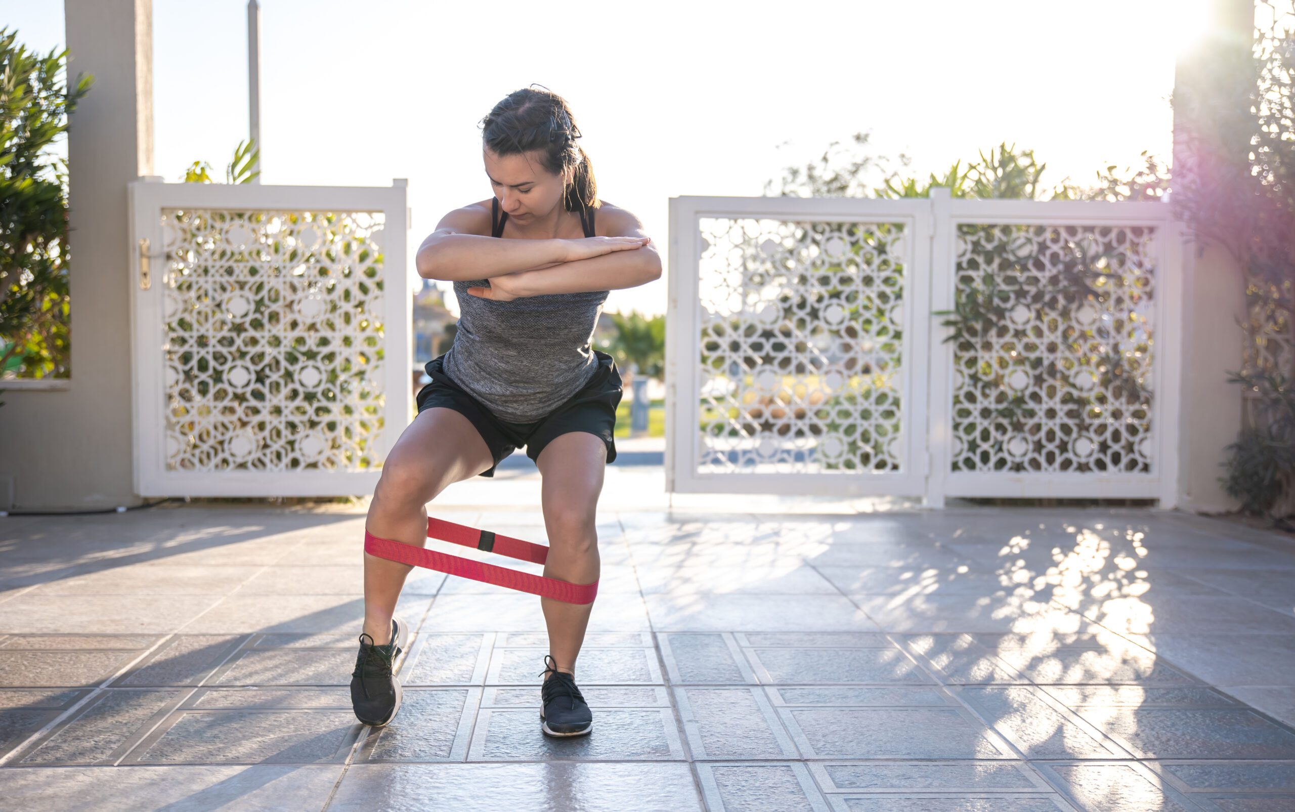 Beginner using a resistance band for an outdoor strength workout